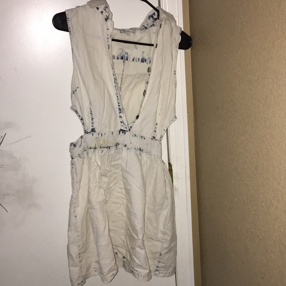 A white dress with some blue details